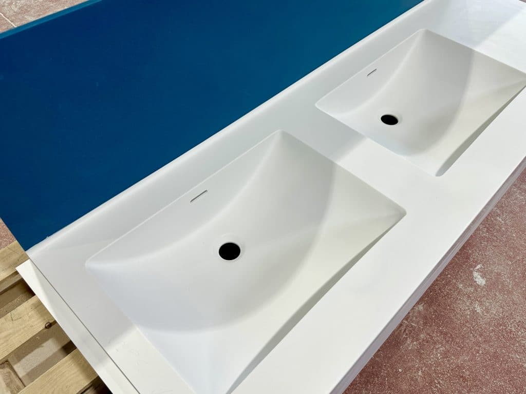 Solid Surface Vanities with integral Himacs Solid Surface Basin. Complete with bespoke 600mm Mirrorbox Unit.